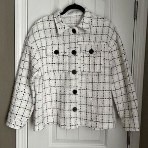 White coat with black and gold plaid design